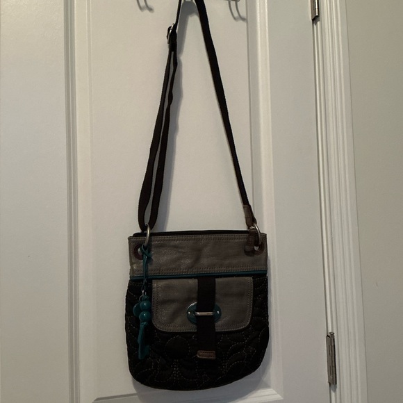 Fossil Crossbody Bag. Black with gray and turquoise trim. Adjustable strap - Picture 4 of 6